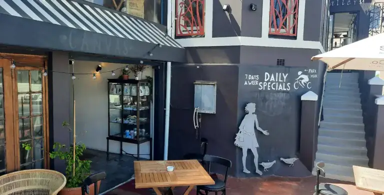 Courtyard Cafe Canvas Kalk Bay courtyard with "Daily Specials" chalk mural and outdoor tables