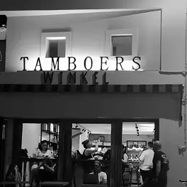 TAMBOERS WINKEL café entrance with patrons seated indoors and standing outside