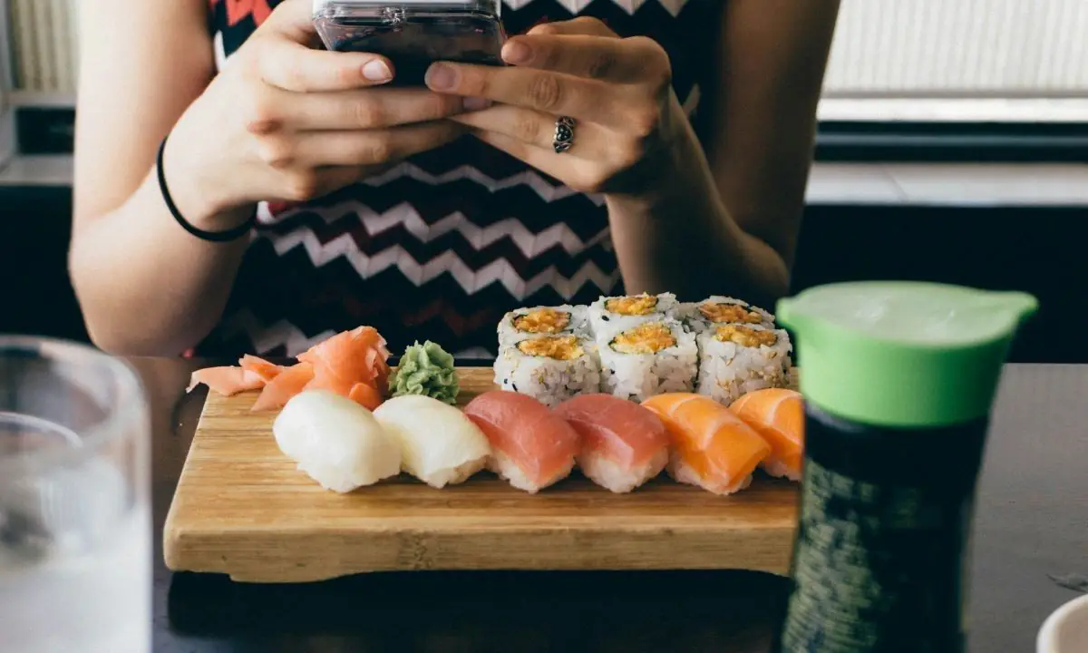 Sushi nigiri and maki rolls on a wooden board for Saturday restaurant specials