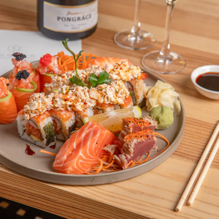 Assorted sushi platter with salmon sashimi, tuna tataki and Pongrácz bottle