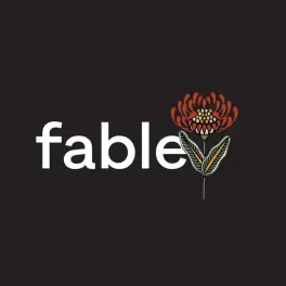 Fable logo with red floral illustration on dark background
